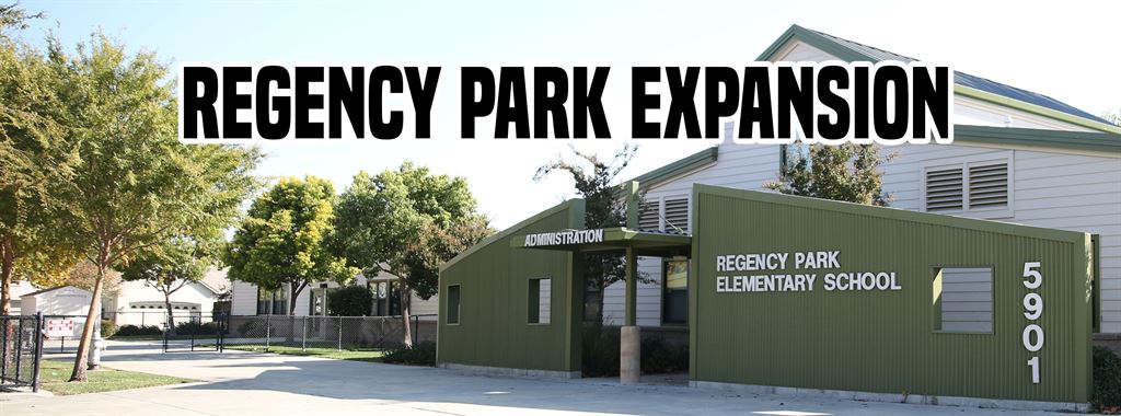 Regency Park Elementary School building with Administration and 5901 signs - title Regency Park Expansion